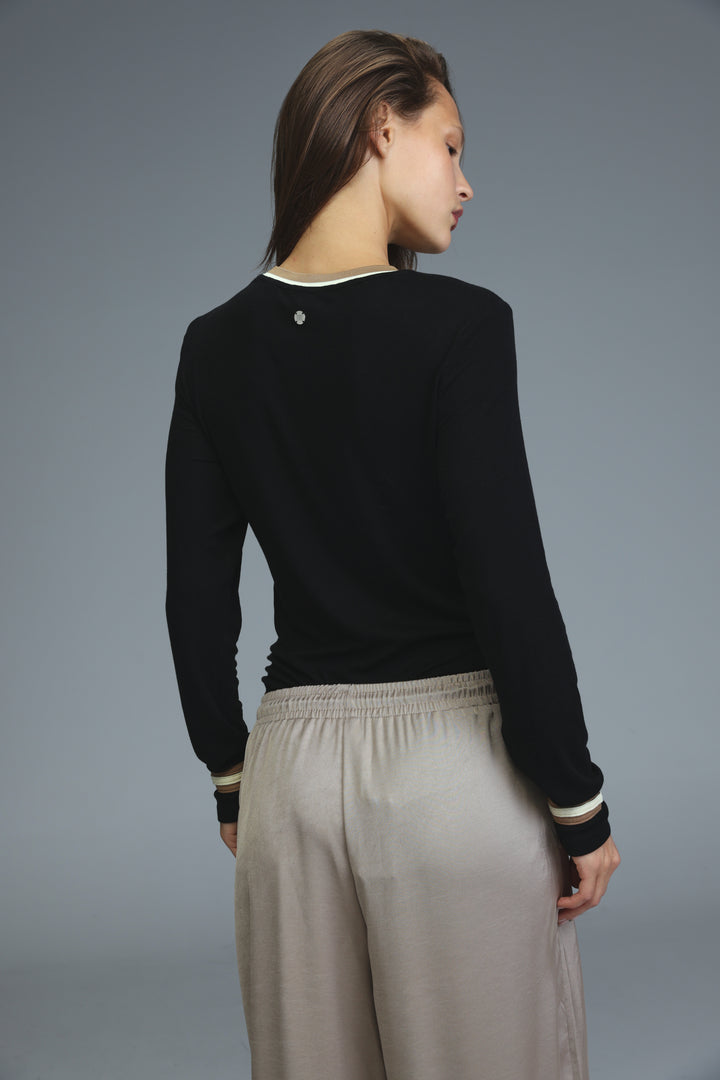 Black long-sleeved bodysuit with cream ribbed trim at neckline and cuffs shown from the front