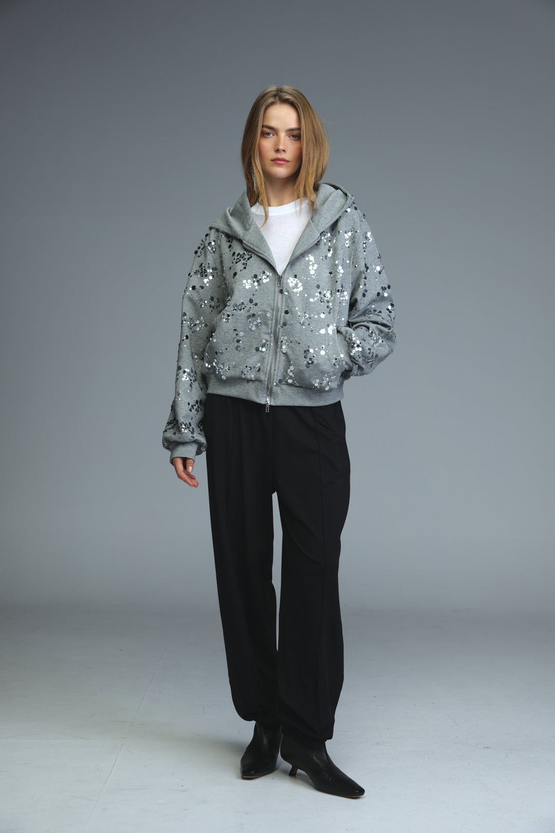 Fortune grey zip-up hoodie with gray sequins and floral pattern shown from the front