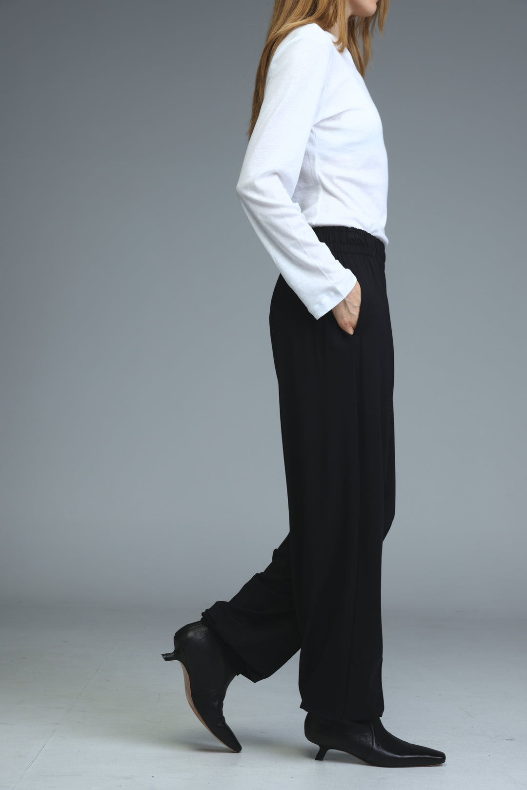 Black wide-leg joggers with a sleek tailored fit shown from the front
