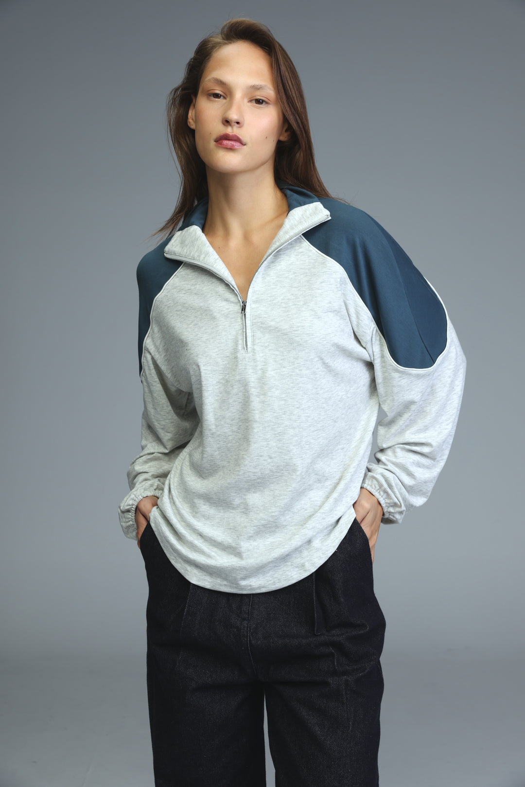 Allure gray sweatshirt with heather gray body and navy blue raglan sleeves half-zip front view