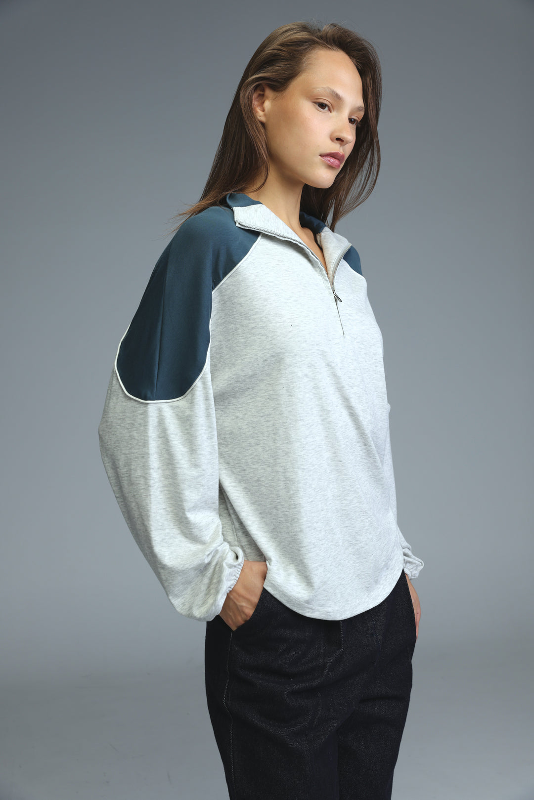 Allure grey sweatshirt with heather gray body, navy blue raglan sleeves, and front zip-up closure shown from the front