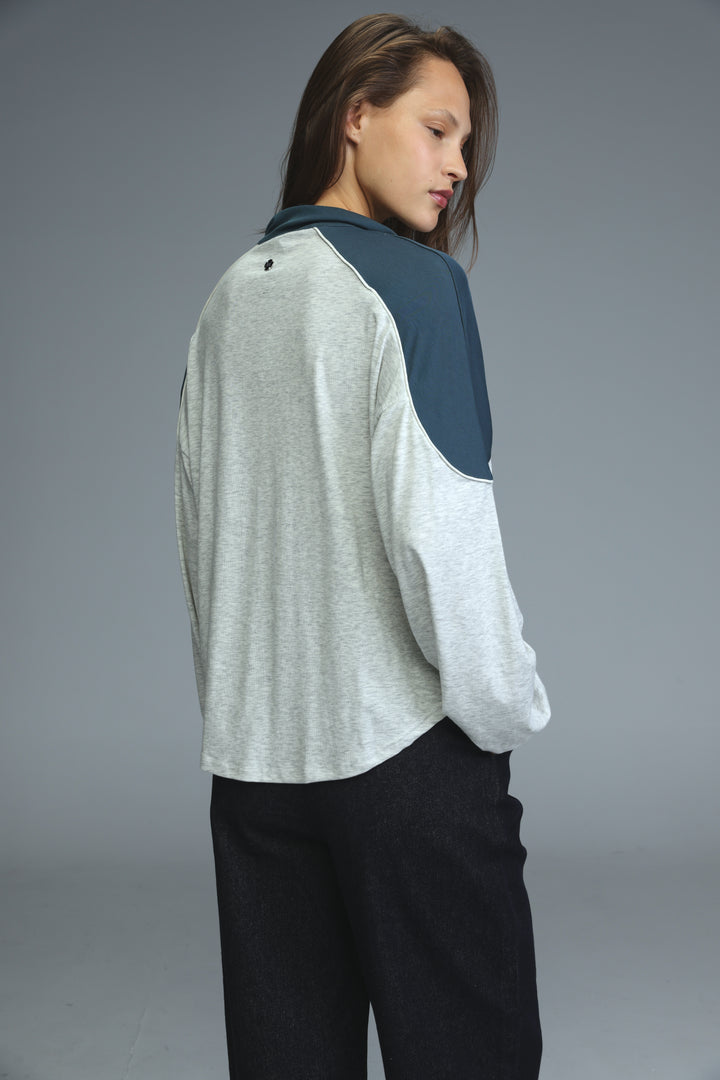 Allure grey sweatshirt featuring a soft heather gray and navy blue color-blocked long-sleeve top with a relaxed fit visible from the front