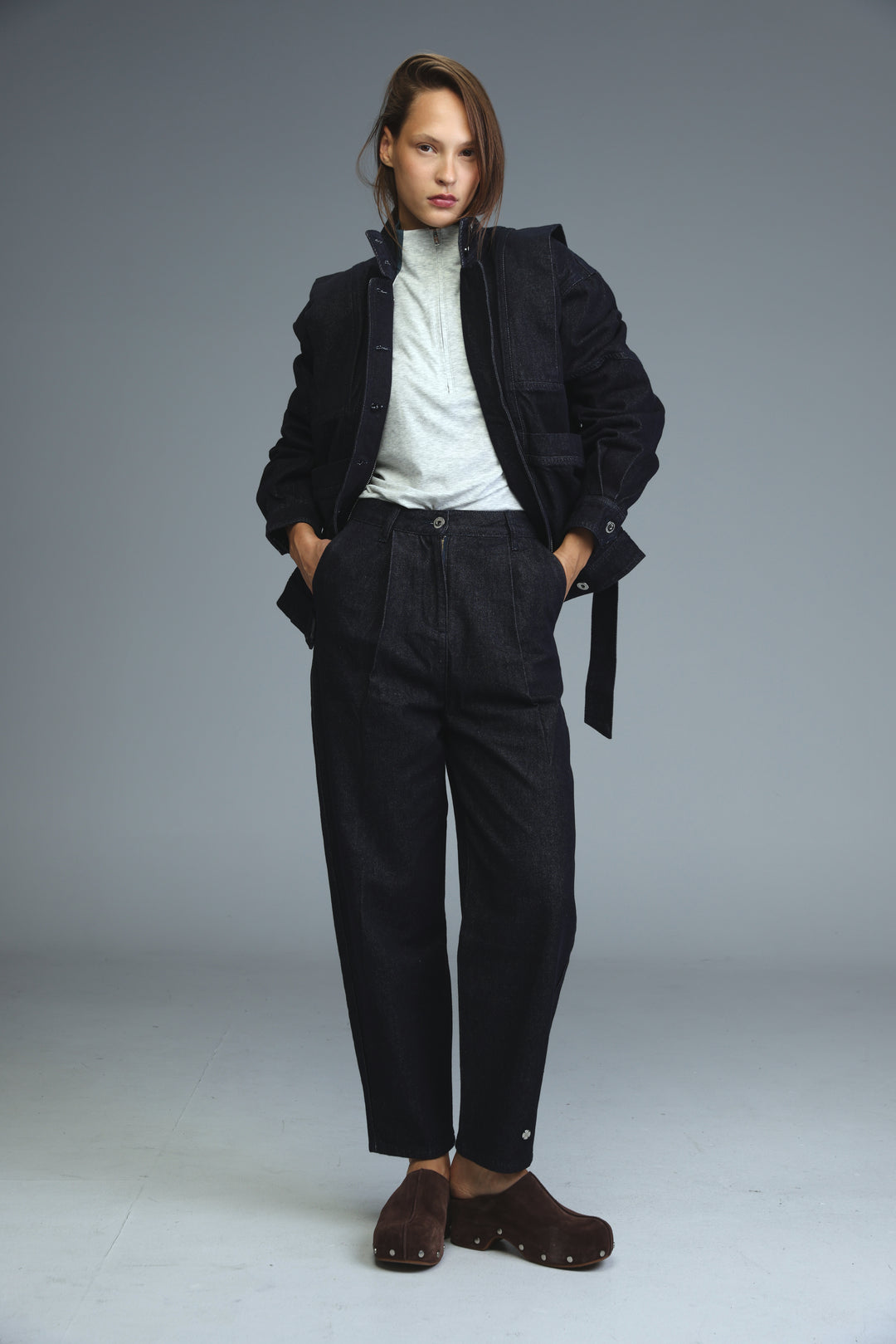 Prestige dark blue denim jacket with structured slightly oversized silhouette and visible stitching details front view