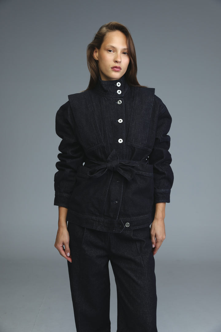 Dark blue denim jacket front view with white buttons and belted waist