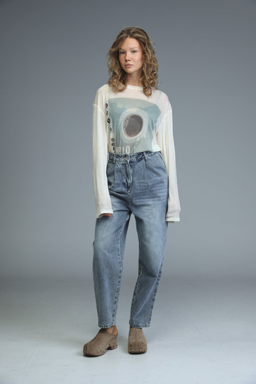 Hello coffee cream shirt white long-sleeved top with light blue abstract circular graphic and vertical text front view