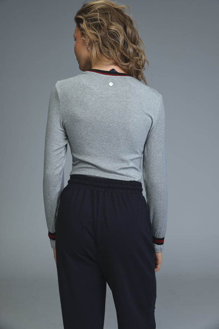 Trim grey bodysuit long-sleeved top with black trim at neckline and cuffs and a small silver button on the back
