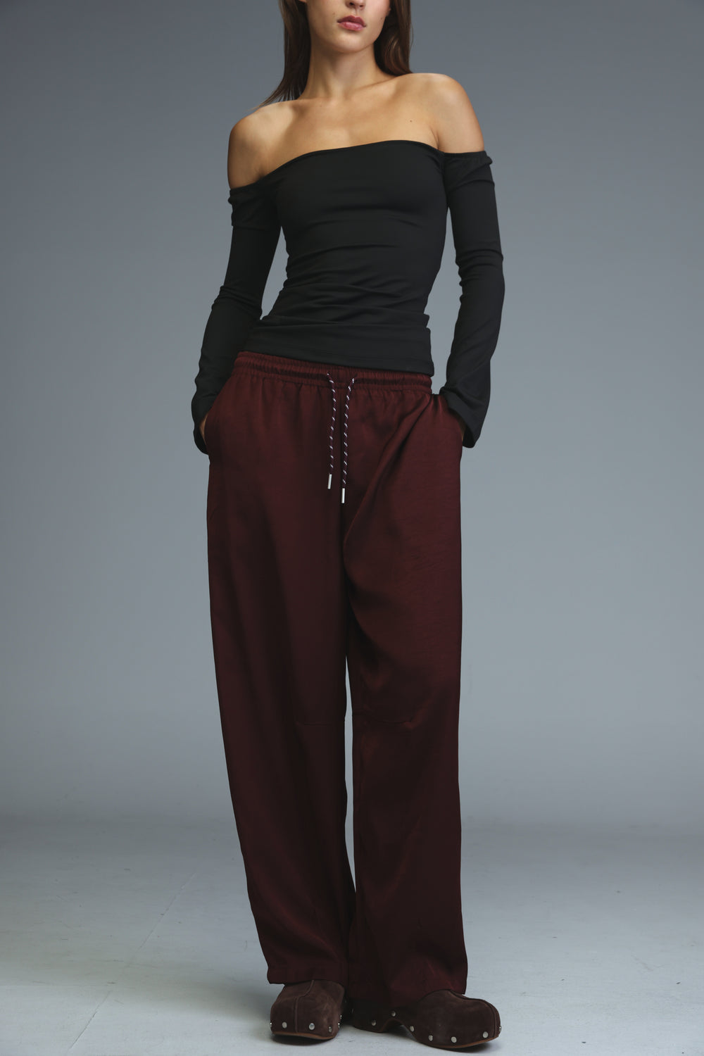 Golden wine wide-leg maroon trousers with drawstring waist and subtle side pockets shown from the front