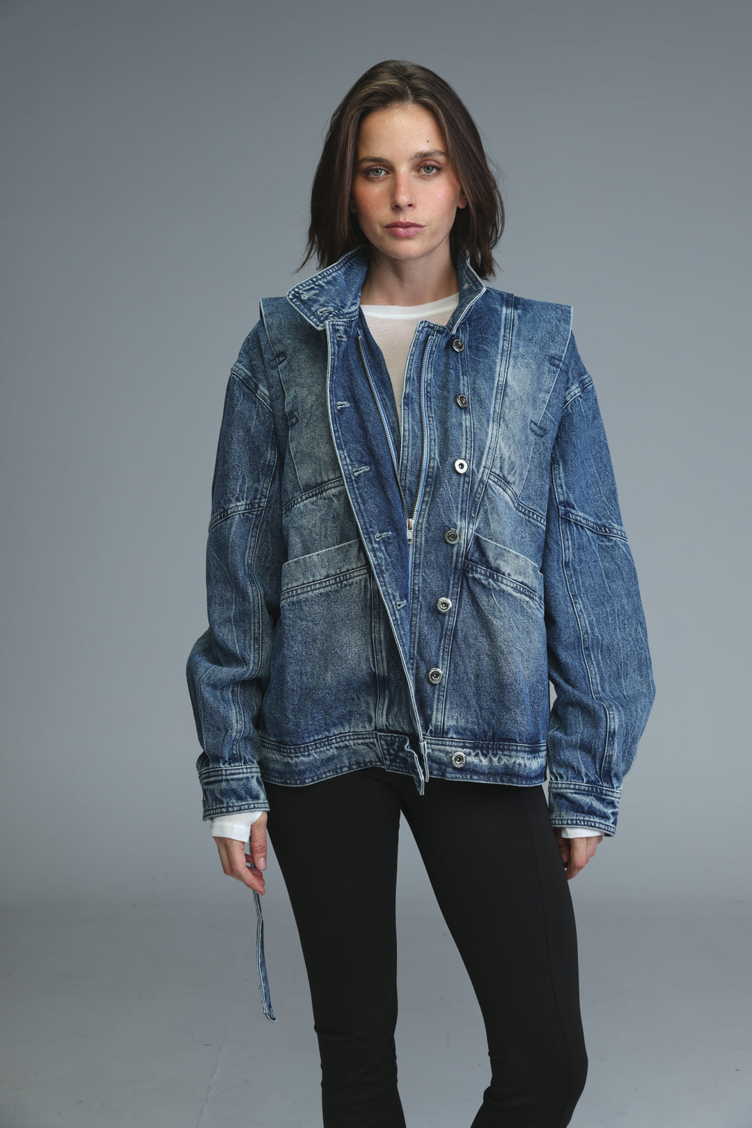 Prestige blue denim jacket with a slightly faded wash and classic button closure shown from the front