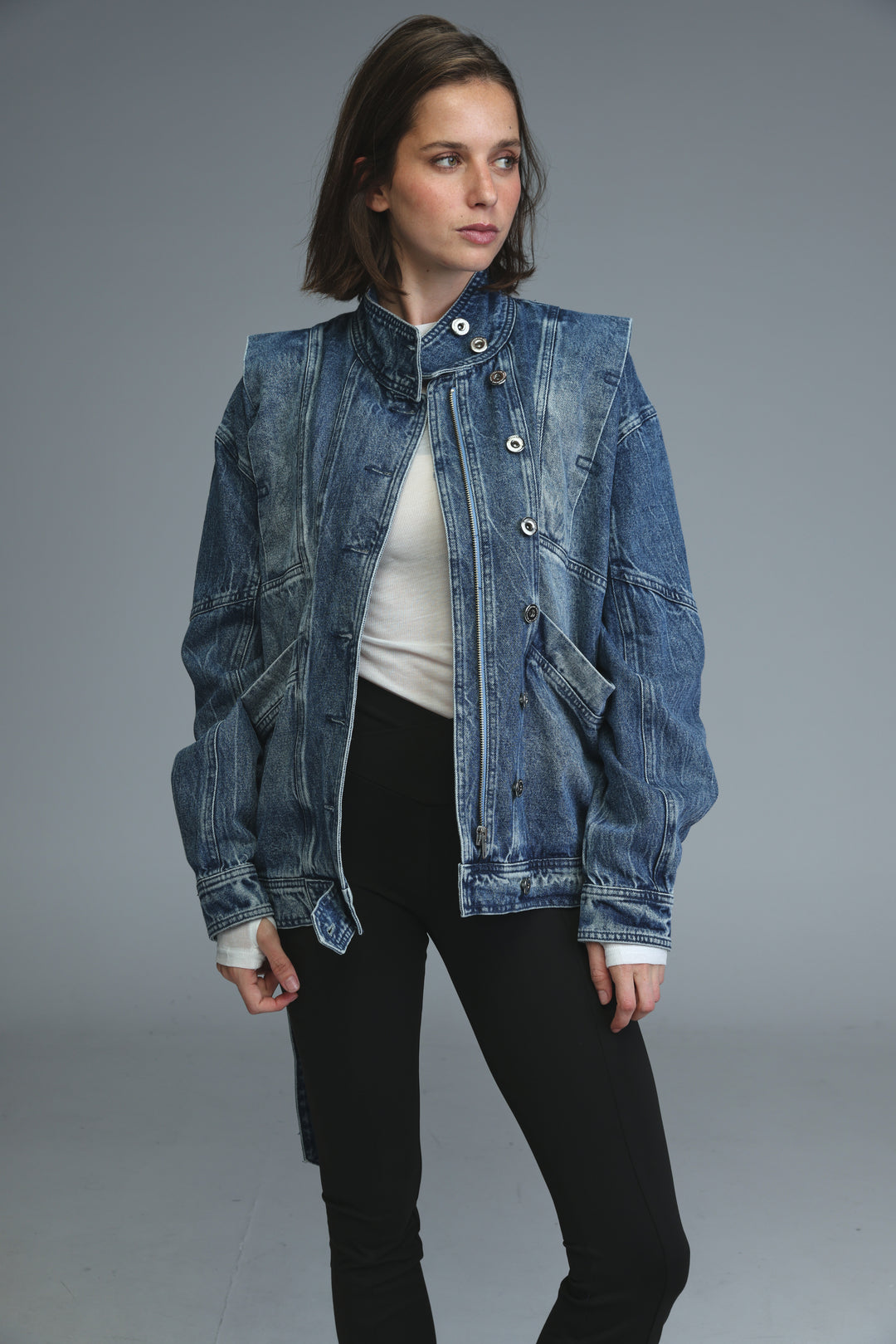 Prestige blue denim jacket with high collar and button closures shown from the front