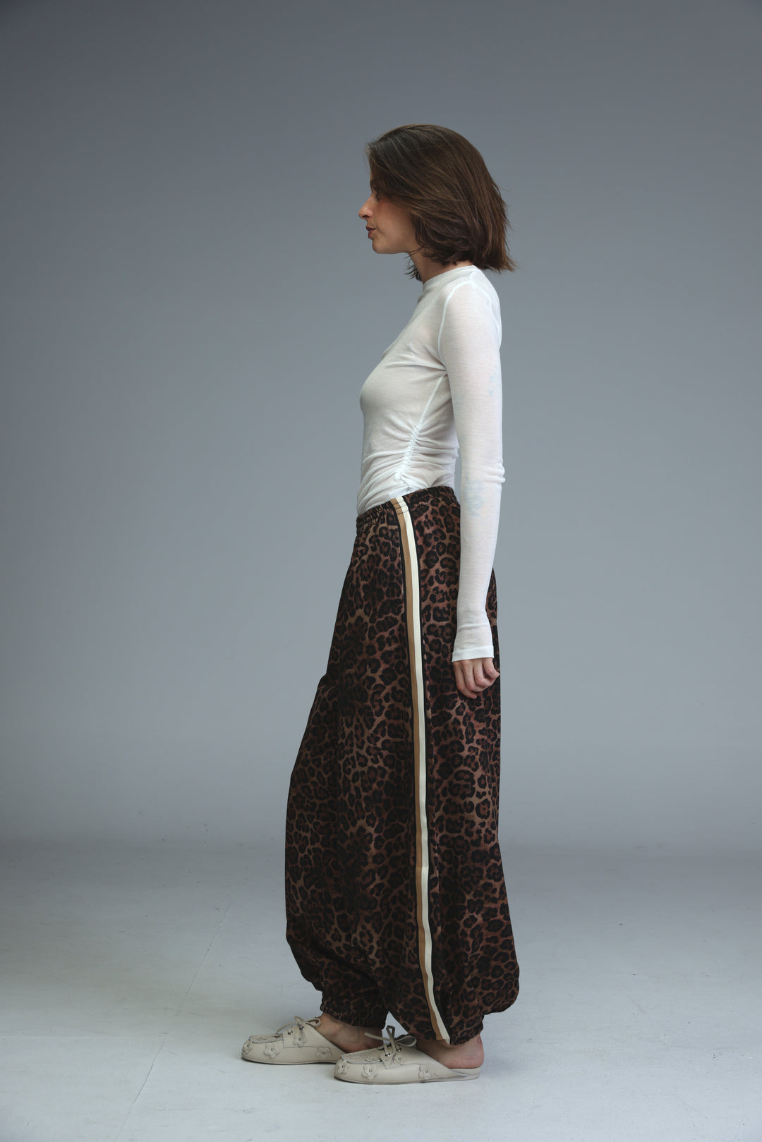 Ballooning leopard striped joggers with beige vertical stripe down the side shown from the front